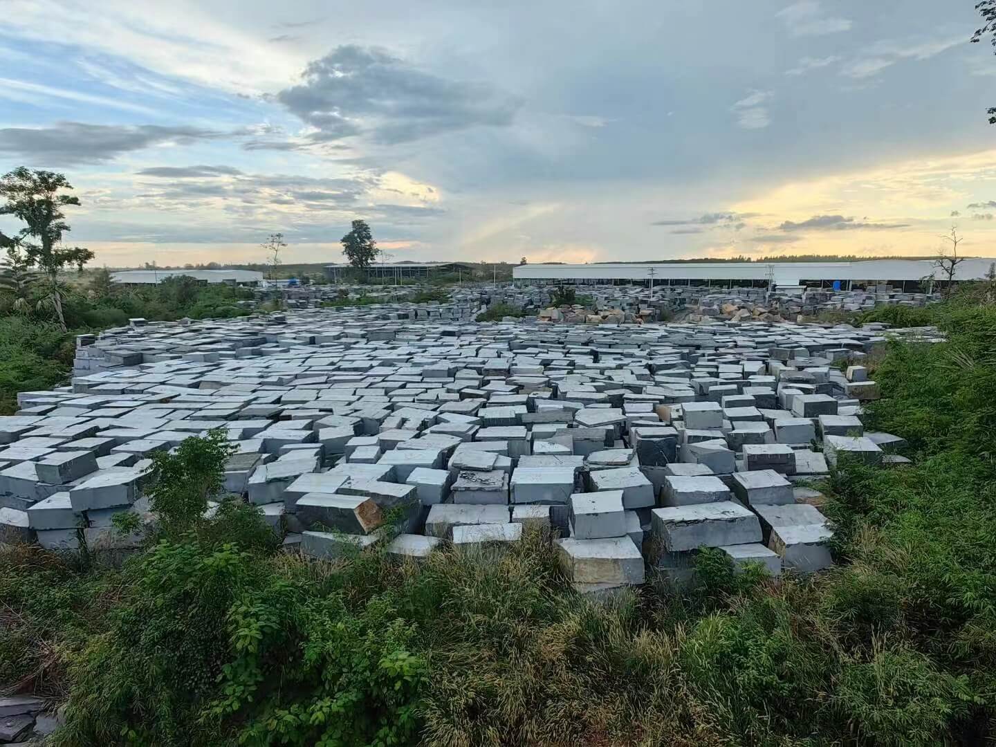 Granite quarry background with factory building